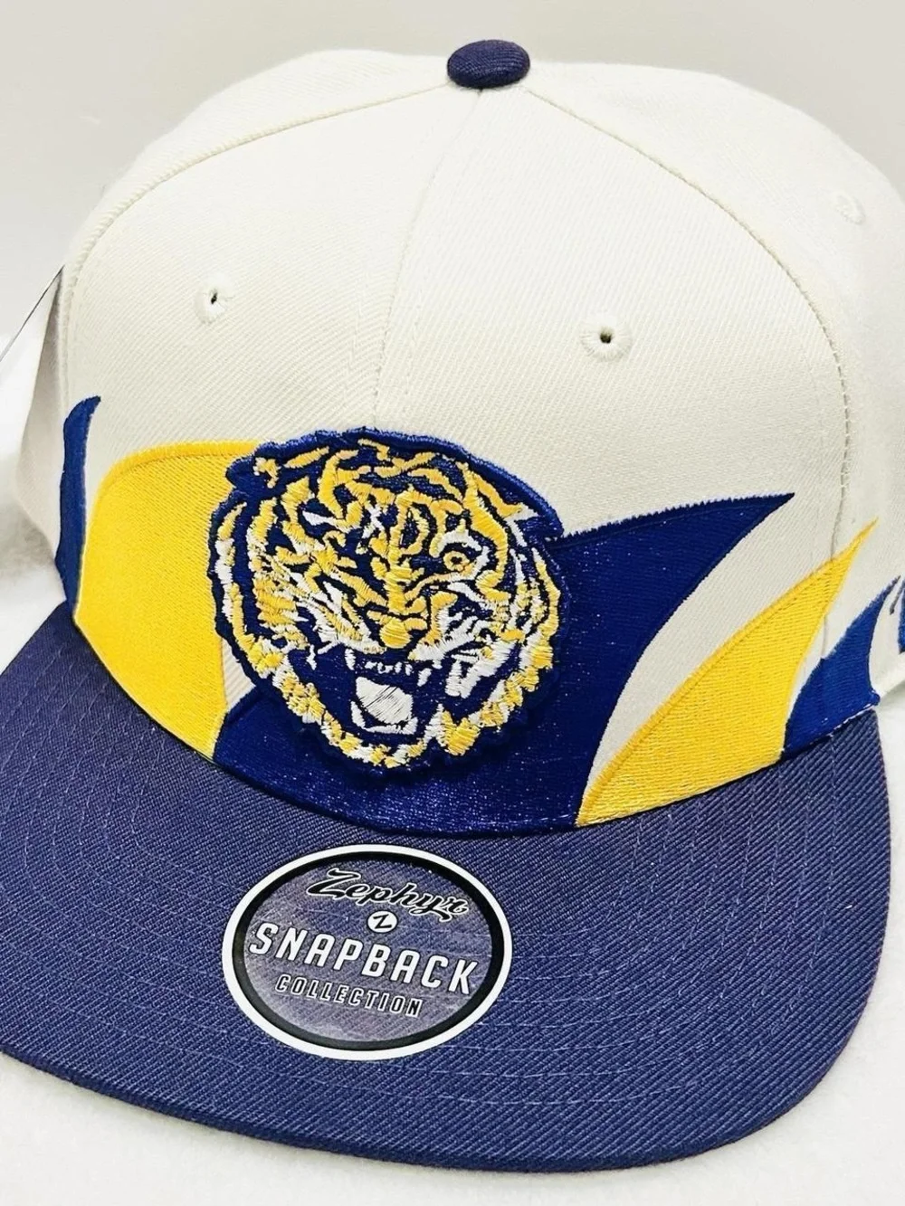 Zephyr Cream Snapback Hat with Purple & Gold Tiger Patch